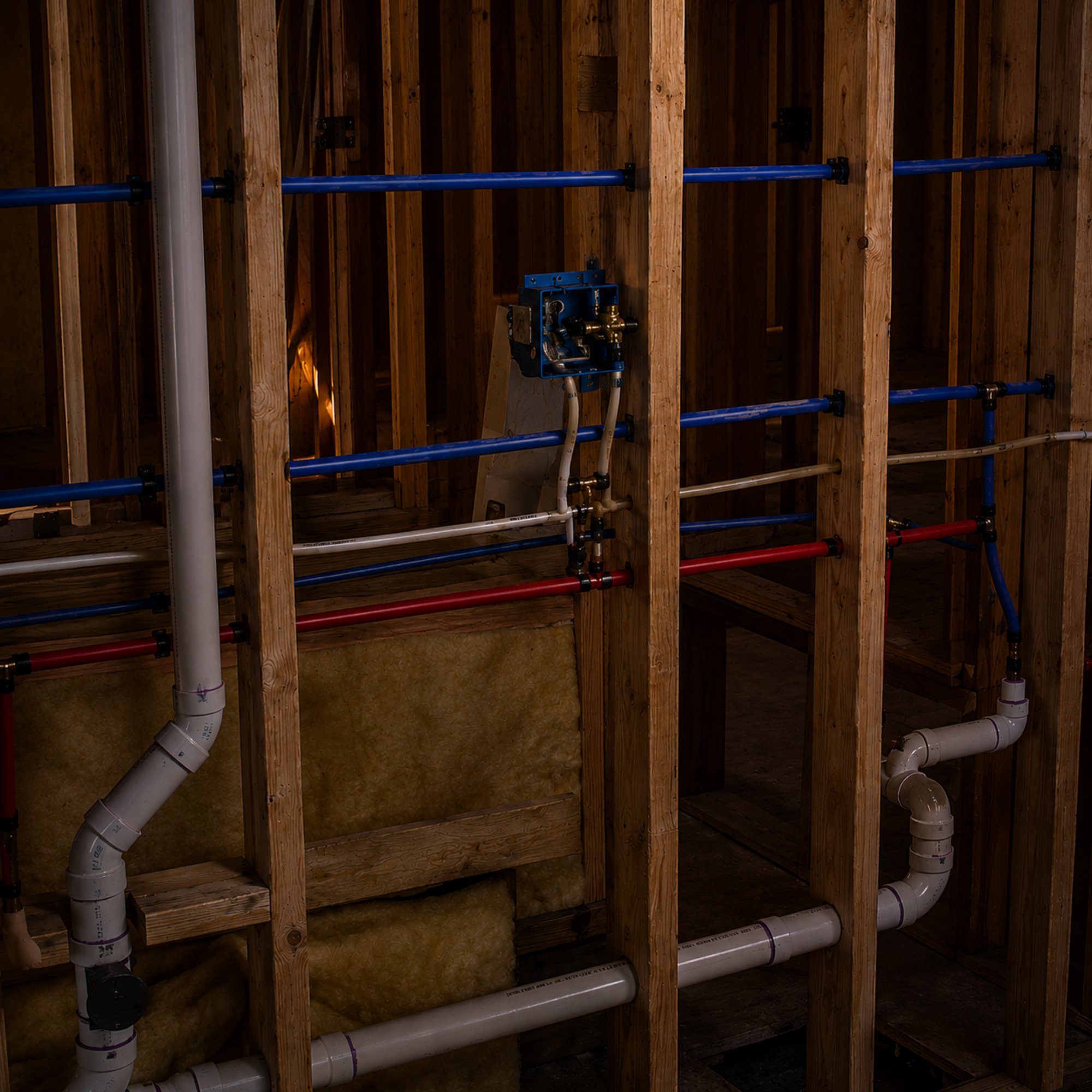 Residential plumbing installed inside an open wall